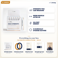 The complete StillStrong system — box, 30 daily sachets, 2 resistance bands, Daily Five & Strength Age cards, and The Handbook